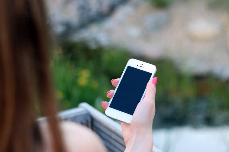 Woman Holding iPhone