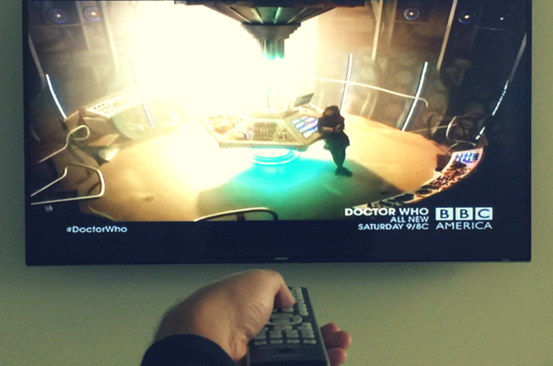 Hand with Remote Pointed at TV