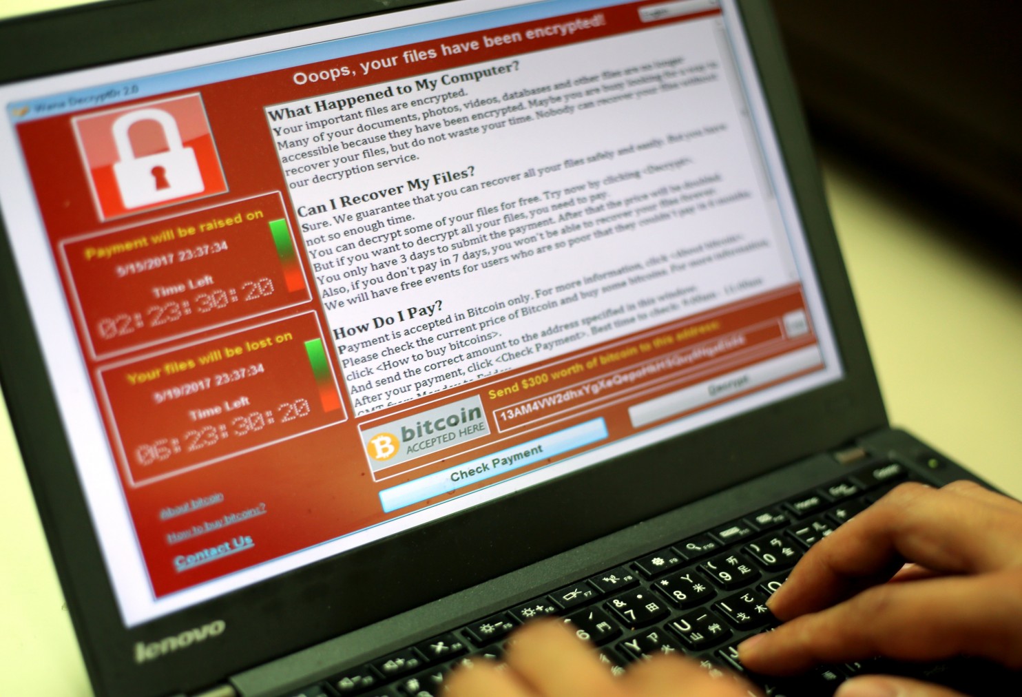 A programmer in Taipei shows a sample of a ransomware attack.