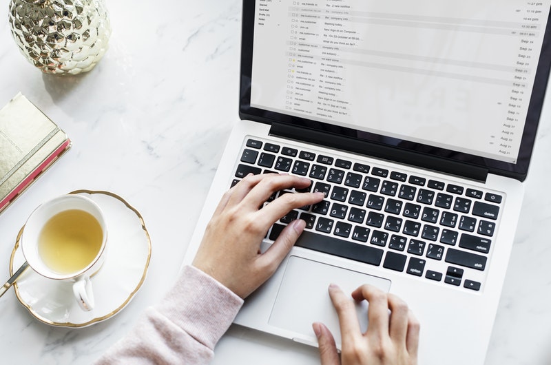 Person on laptop reviewing email Person on laptop reviewing email