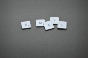 Computer keys on grey background spelling out Email