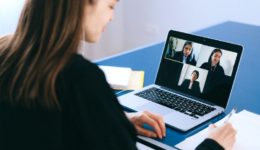 Person on a video conferencing call with three people on the screen