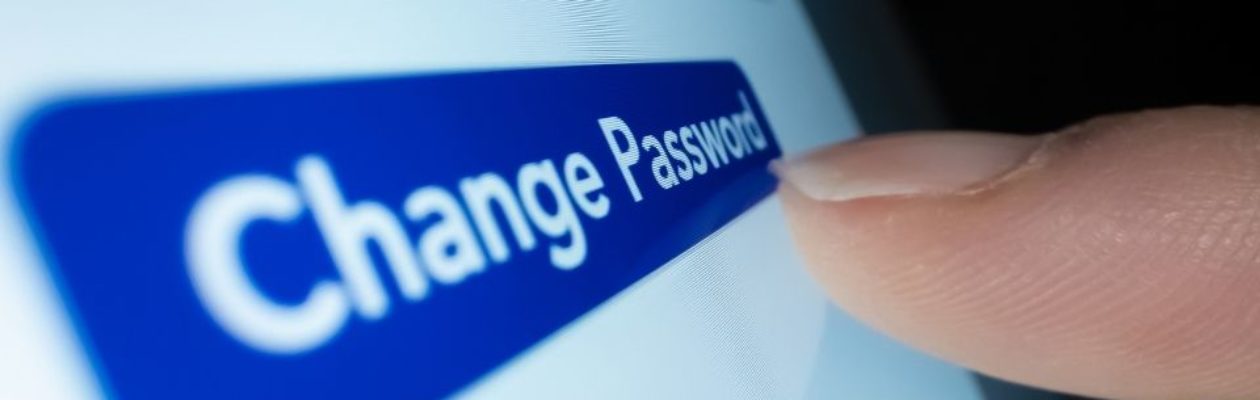 Person tapping on change password button on device