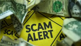 Scam Alert text Surrounded by Crumpled US Bills